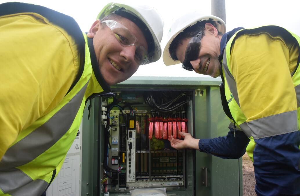 CONNECTING UP: Visionstream's Luke Marchewka and Domenic Diplacido inspects one of the NBN nodes being installed in suburban streets across Bendigo. 