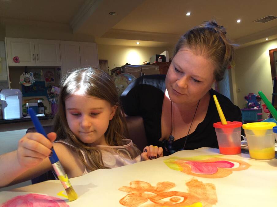 PREPARATIONS: Ali and her mother Susanna Flanagan prepare for next month's home school exhibition at the Bendigo Library.