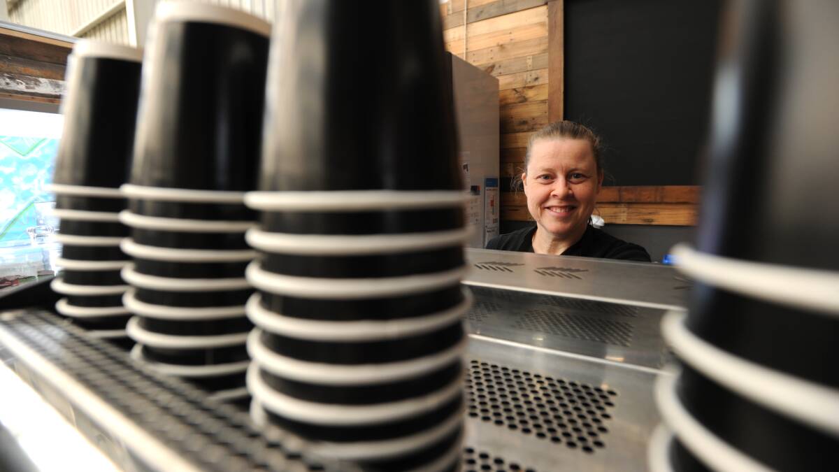 CAFE TO RAISE FUNDS FOR HOMELESS: Melissa Tshisekedi works the coffee machine at the ARC Cafe Connexions. Picture: NONI HYETT