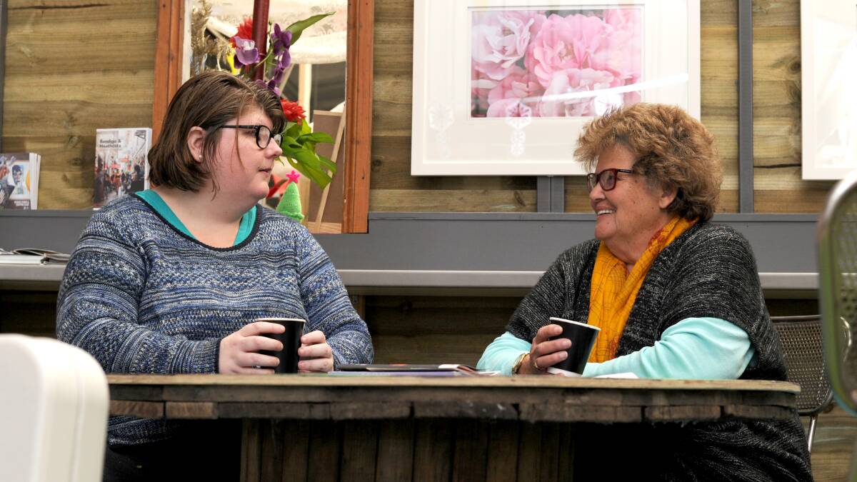 BREAK TIME: Jessica Lucas and Petronella Parker enjoy enjoy coffee at ARC Cafe Connexions in Kennington's LQ Market. Picture: NONI HYETT
