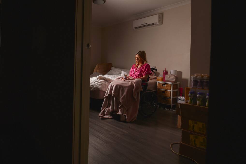 Bec Smethurst says she cannot get out of bed without the help of a carer and needs more help. Picture by Darren Howe