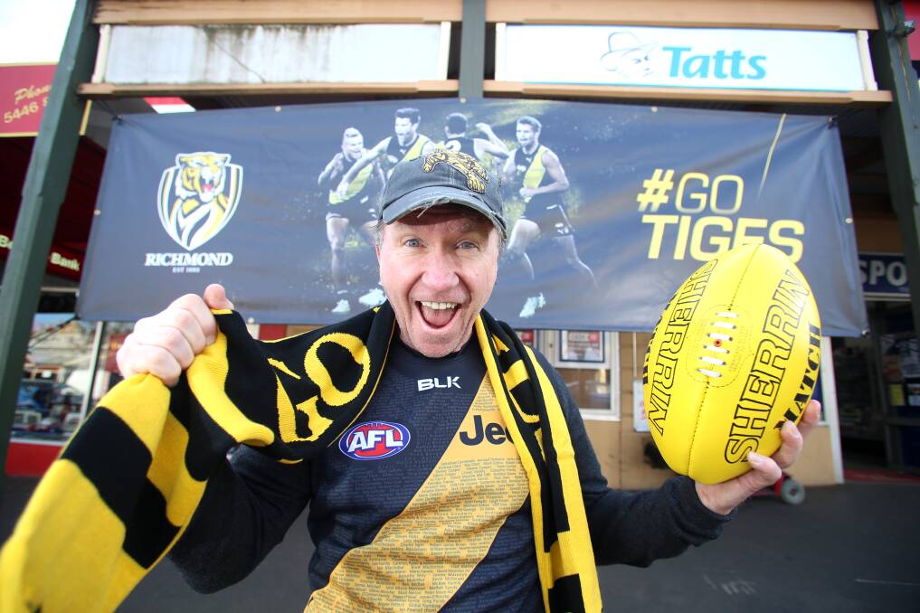 BLACK AND YELLOW: Leo Trainor's news agency has become a shrine to the Tigers ahead of this weekend's clash with the Giants. Picture: GLENN DANIELS