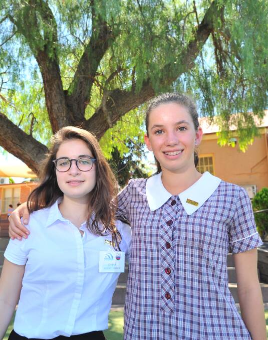 TIME TO TALK: French student Emma Bellouet-Guilbot discusses her trip with host Girton Grammar student Sophie Ginis. Picture: NONI HYETT