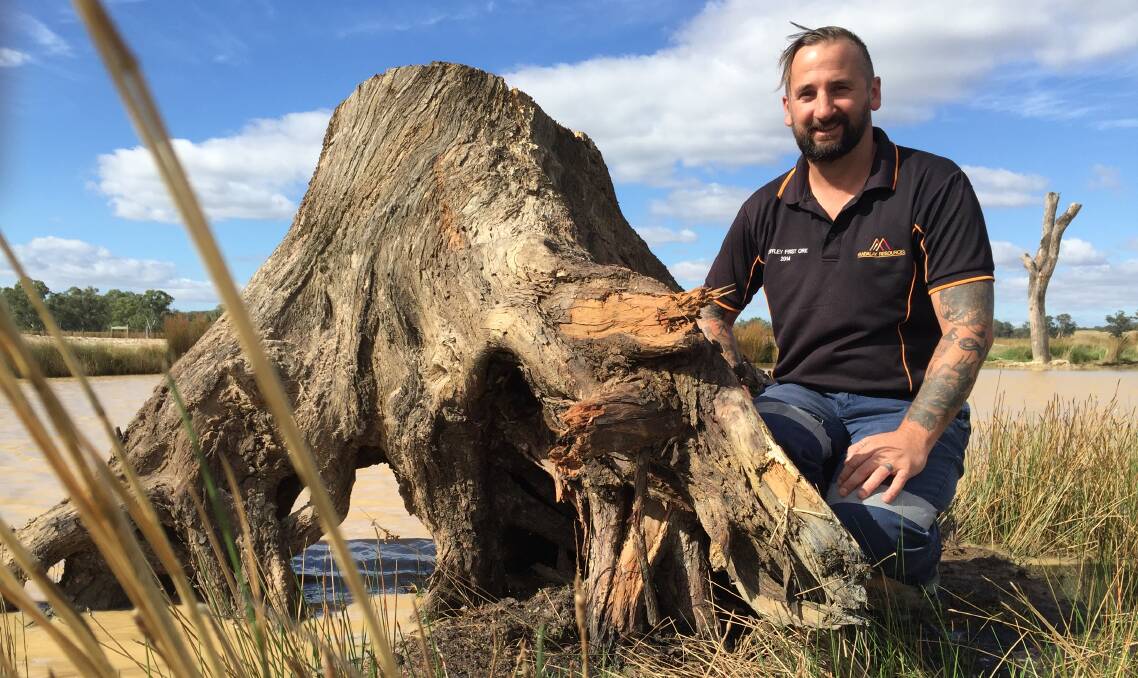 SANCTUARY: Joel North with a tree stump - one of a number of places critters can hide on land being transformed into a wetland system.