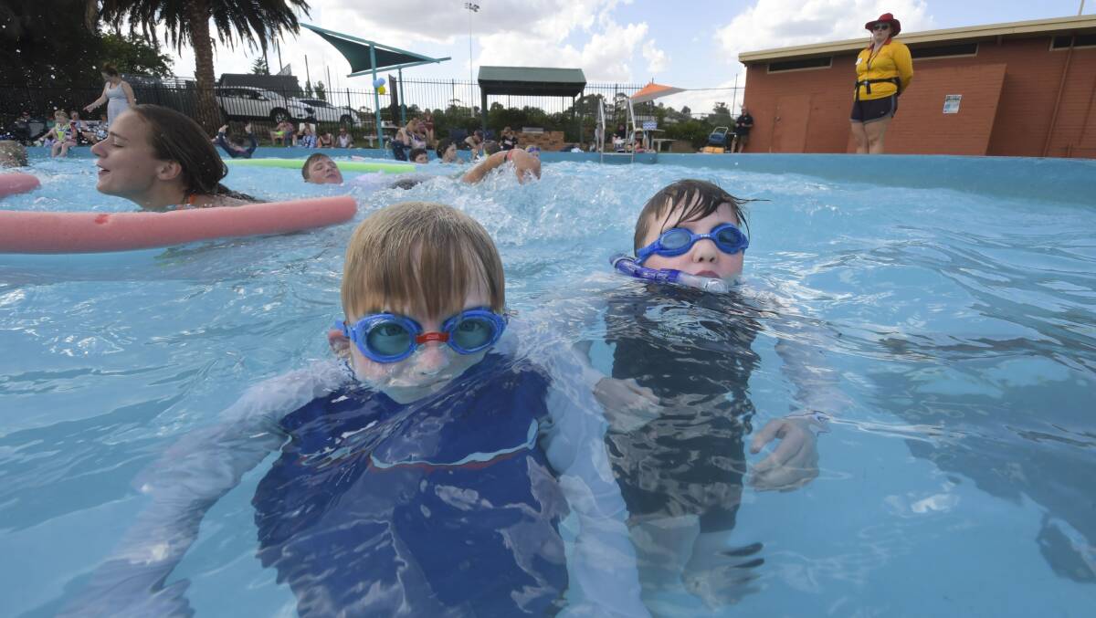 Beating the heat: Noah and Lewis cool off at Golden Square Pool. Picture: Noni Hyett
