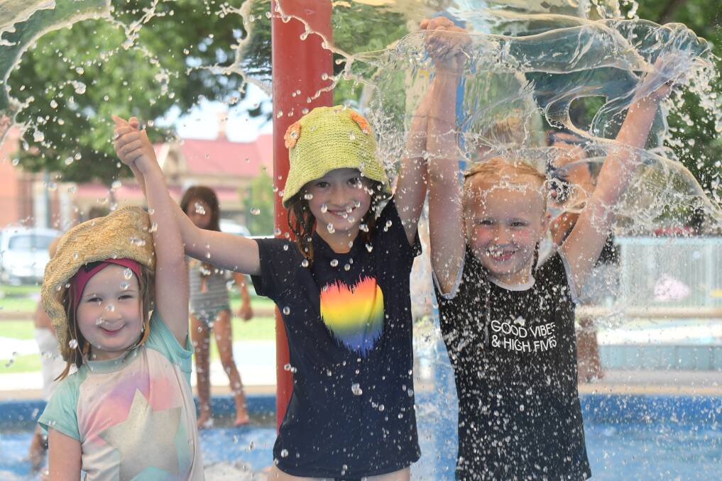 Matilda Cowie, Lila Cowie and Lux Delves knew how to beat the heat on Saturday, cooling off at the Bendigo Aquatic Centre. Picture: NONI HYETT
