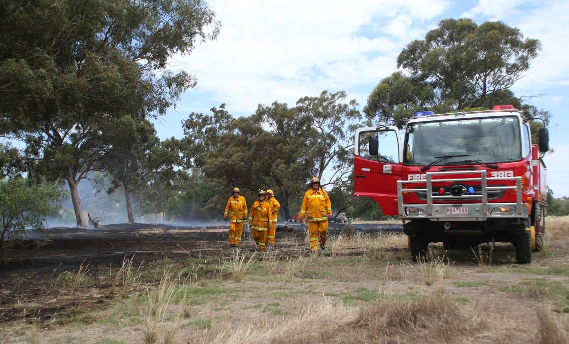 Firefighters at the scene of a fire in Huntly on a day of total fire ban. Picture: GLENN DANIELS