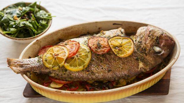 Whole baked snapper with Catalan-style wilted spinach. Photo: Marina Oliphant