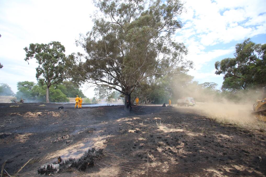 Firefighters at the scene of a fire in Huntly in December. Picture: GLENN DANIELS
