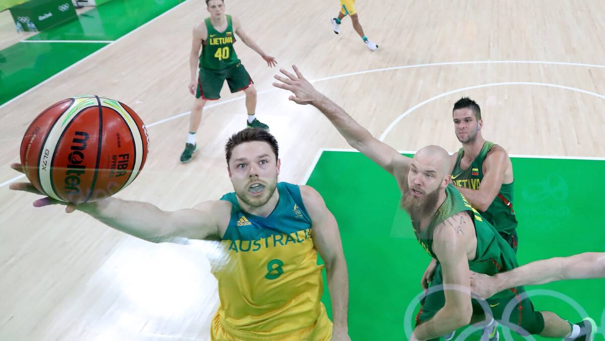 Matthew Dellavedova shoots the ball over Antanas Kavaliauskas #12 of Lithuania during the Men's Quarterfinal match. Picture: Getty Images
