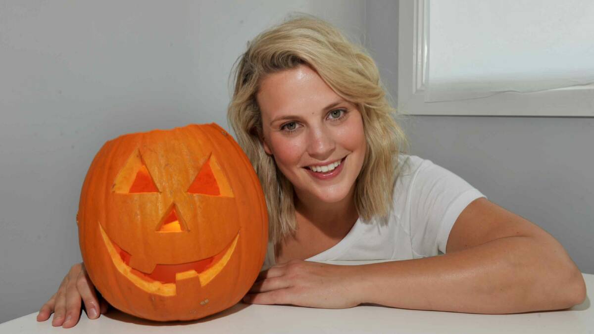 HAPPY HALLOWEEN: Lucy Dickson shows us how you can carve your own jack-o'-lantern. Picture: NONI HYETT