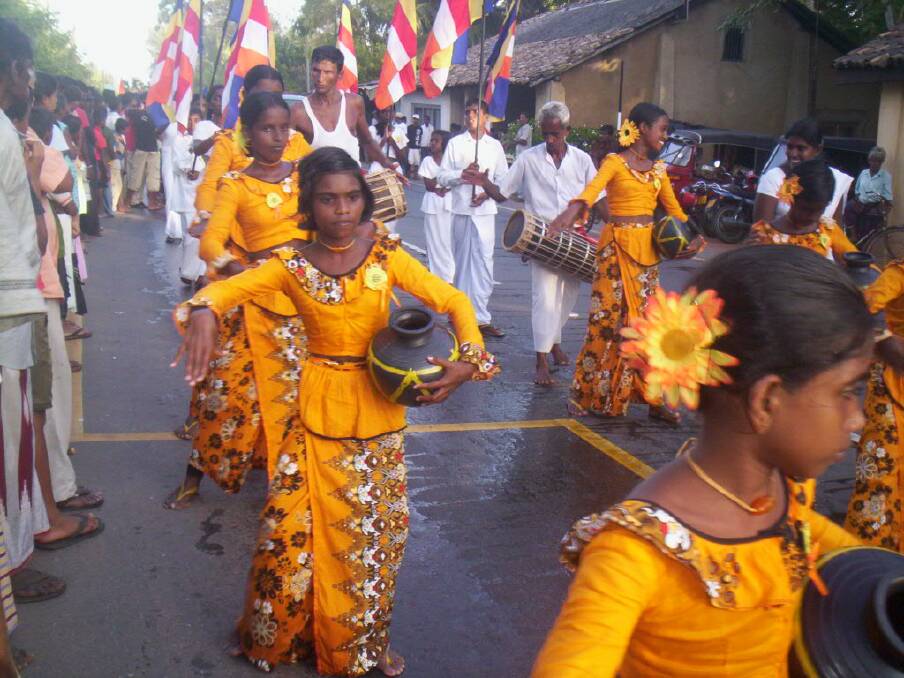 FAITH: While visiting Sri Lanka, author Gloria Meltzer captured this procession of a Buddhist festival. Picture: SUPPLIED