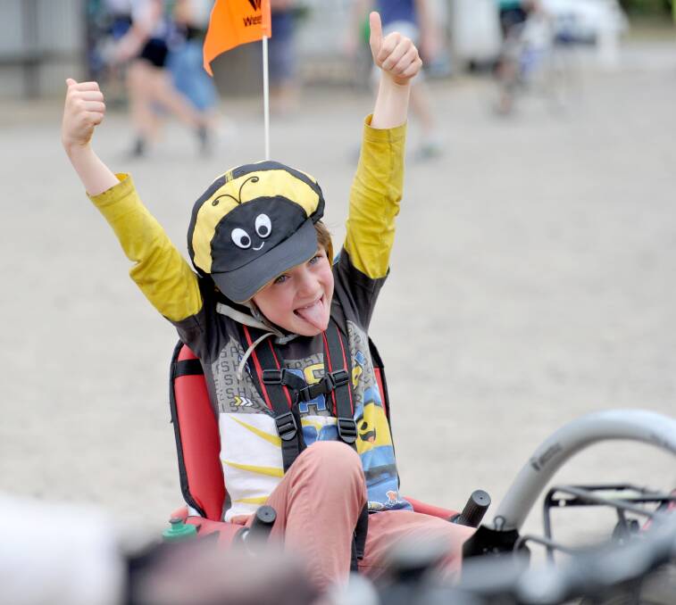 VICTORY: Eight-year-old Nathan Dunn completes the Great Victorian Bike Ride in Bendigo. Picture NONI HYETT