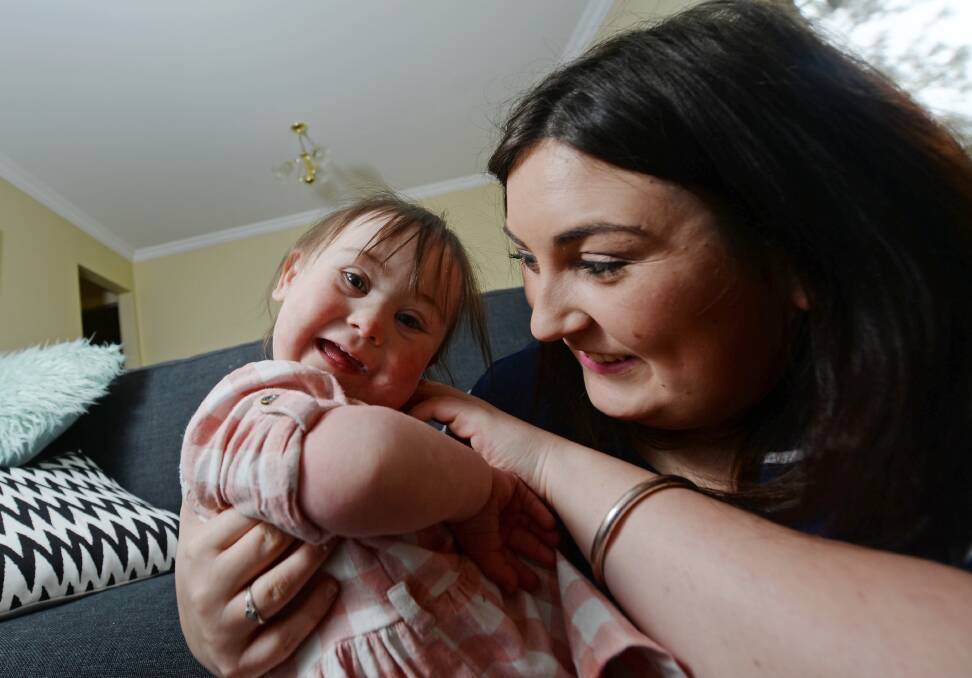 CALL TO INCLUDE: Paige Moore with two-year-old daughter Charlie Moore-Nelson, 2, who has down syndrome. Picture: DARREN HOWE