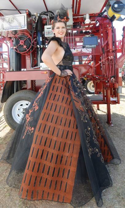 FIREBALL: Model wears "Majestic Blaze" - the flame-inspired creation by Katrina Christie, winning the design section in the Ag Art Wear event. Picture: DARREN HOWE