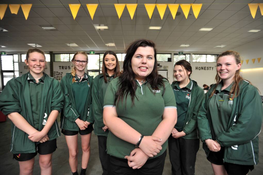 GOLDEN GIRLS: Crusoe College students Jess Maher, Bec Conway, Amanda Rodda, Ryllee Waite, Kiarah Witcombe and Jess Allen are giving their all to community projects. Picture: NONI HYETT