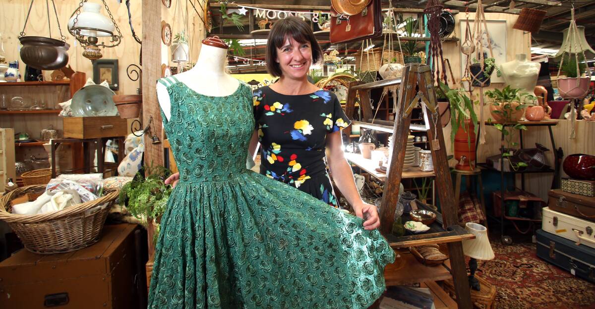 NOSTALGIA: Castlemaine Vintage Bazaar manager Jane Goodrich with a vintage dress sourced from the United States. Picture: GLENN DANIELS
