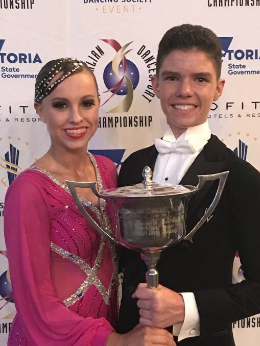 CHAMPIONS: Berkley Wood and Sam Brown celebrating victory at the Australian Dancesport Championships held in Melbourne at Hisense Arena. Picture: SUPPLIED.