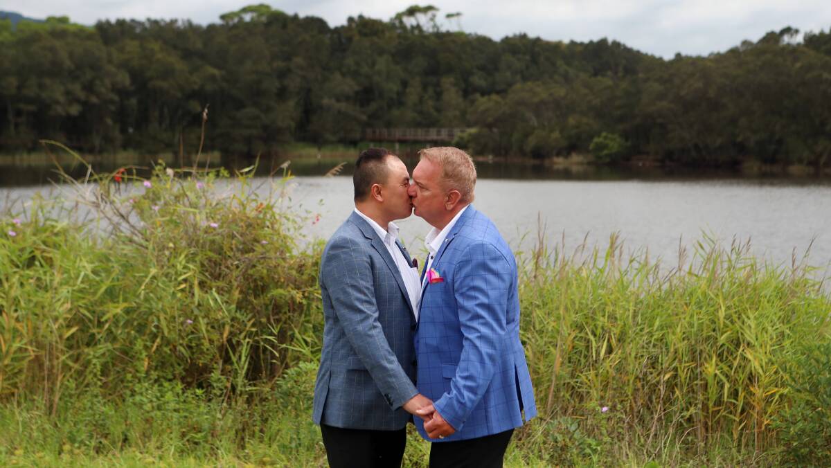 JUST MARRIED: Edward Kwok-Hobbs and Michael Hobbs celebrate their marriage at the Lagoon this morning. Pictures: Sylvia Liber