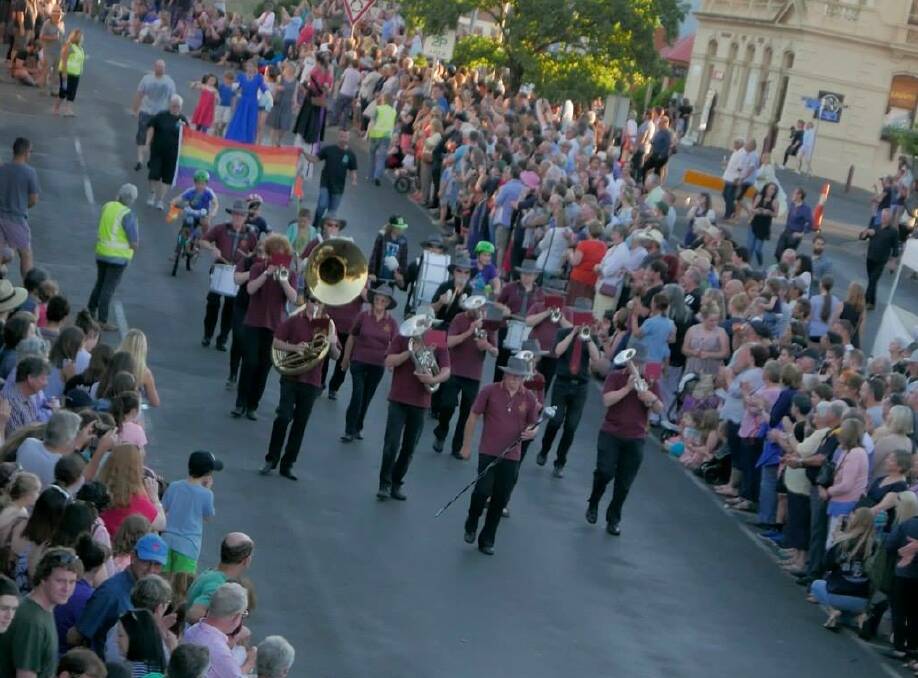 Entertaining the crowds: A brass band marches down Vincent Street as part of the Daylesford New Year's Eve Parade and Gala on Saturday night.  Picture: Anne Stewart. 