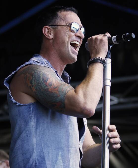In control: Shannon Noll was one of a string of artists who had the crowds on their feet at the Red Hot Summer Tour in North Gardens on Saturday.  Picture: Dylan Burns. 