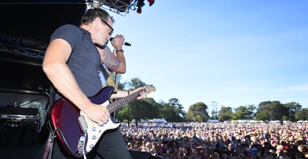 Shredding: Shannon Noll's band had the punters on their feet despite temperatures pushing 30 degrees.  Picture: Dylan Burns.  