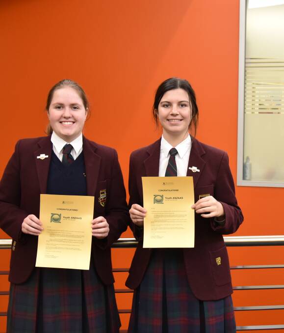 EXCITED: Ruby Stone and Maya Mann with their letters of offer from ANZAAS. The science-loving pair study biology and chemistry. Picture: CONTRIBUTED
