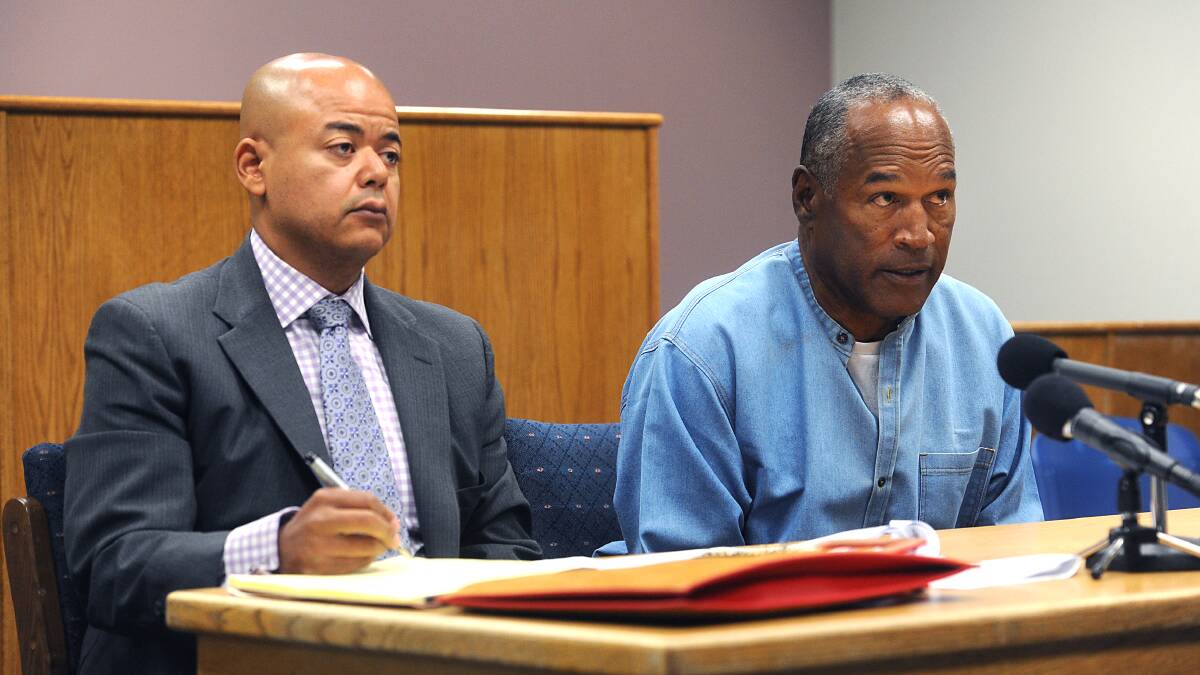 OJ Simpson with his attorney, Malcolm LaVergne, left, appearing via video for his parole hearing. Photo: AP