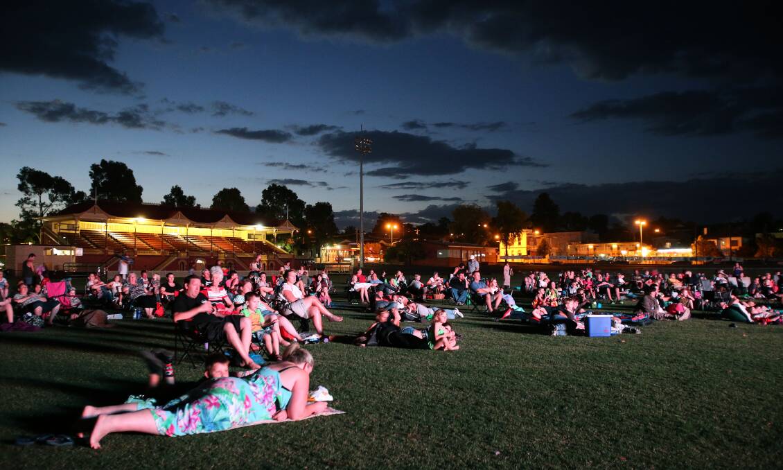 CINEMA UNDER THE STARS: Crowds enjoy the outdoor cinema at the 2015 Summer in the Parks. There will be seven outdoor cinema sessions in January.