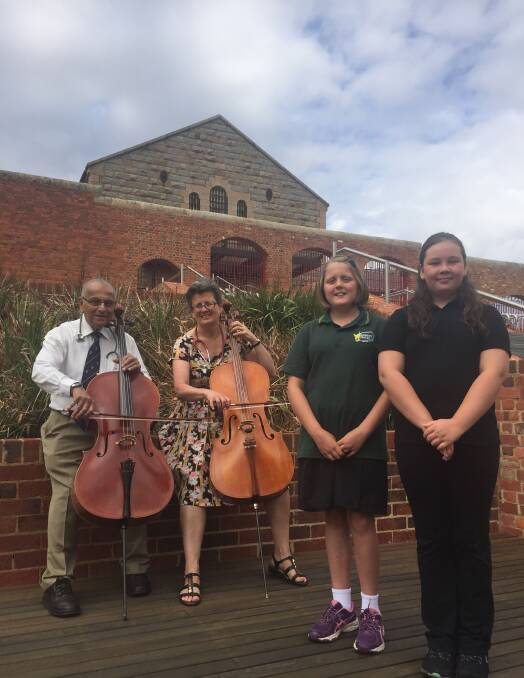 IN TUNE: Doctors and cellists Travis Perera and Beth Pennington with Youth Choir's Rose Foulds and Sianah Jessup. 