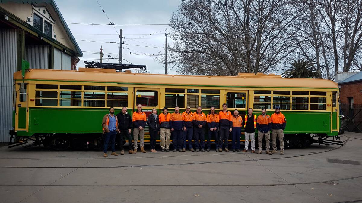 Some of the crew who worked on restoration of six City Circle trams. Photo: SUPPLIED