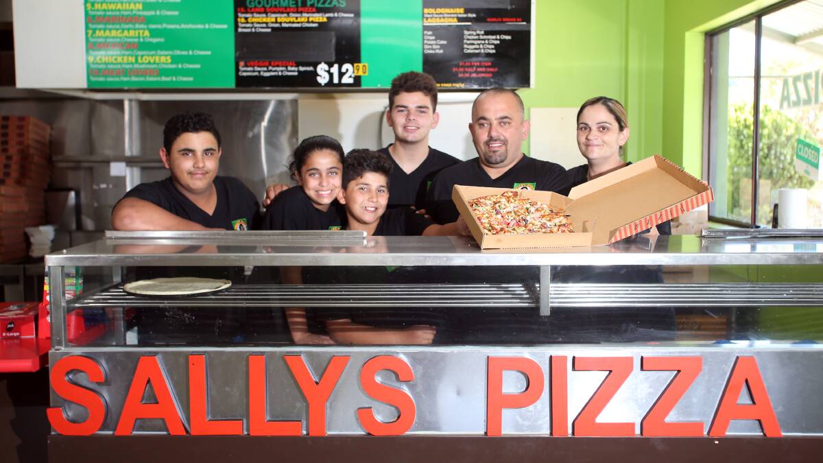 FAMILY EFFORT: The Kabalan family runs Sally's Pizza. Charlie, Chantelle and Paul Kabalan, Kane Burns, John and Kate Kabalan. Picture: GLENN DANIELS