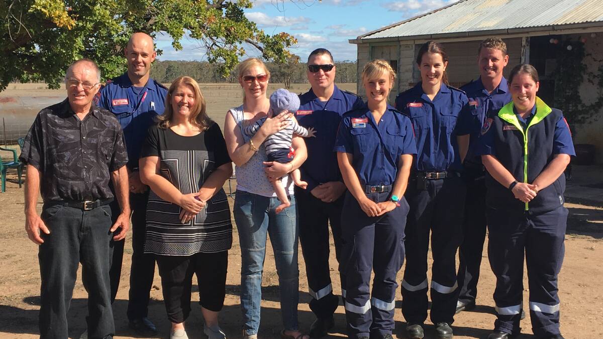 Dennis Lacey with MICA paramedic Anthony McQueen, neighbours Val Cunsolo and Sue Henderson (with her son William) ad paramedics David Mackowski, Alana Valkenburg, Elli Gregor, Troy Harvey and Isla Douglas.