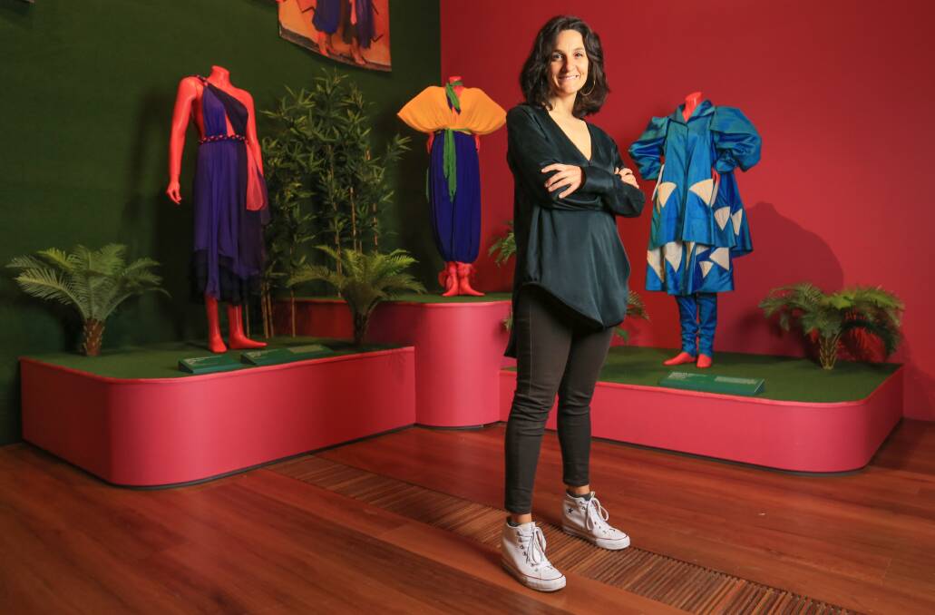 NGV curator of fashion and textiles Paola Di Trocchio with some of Linda Jackson's designs.