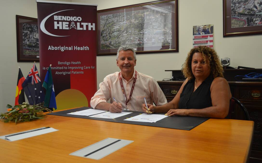 SIGNED: Bendigo Health chief executive John Mulder and BDAC chief executive Raylene Harradine. Picture: Contributed