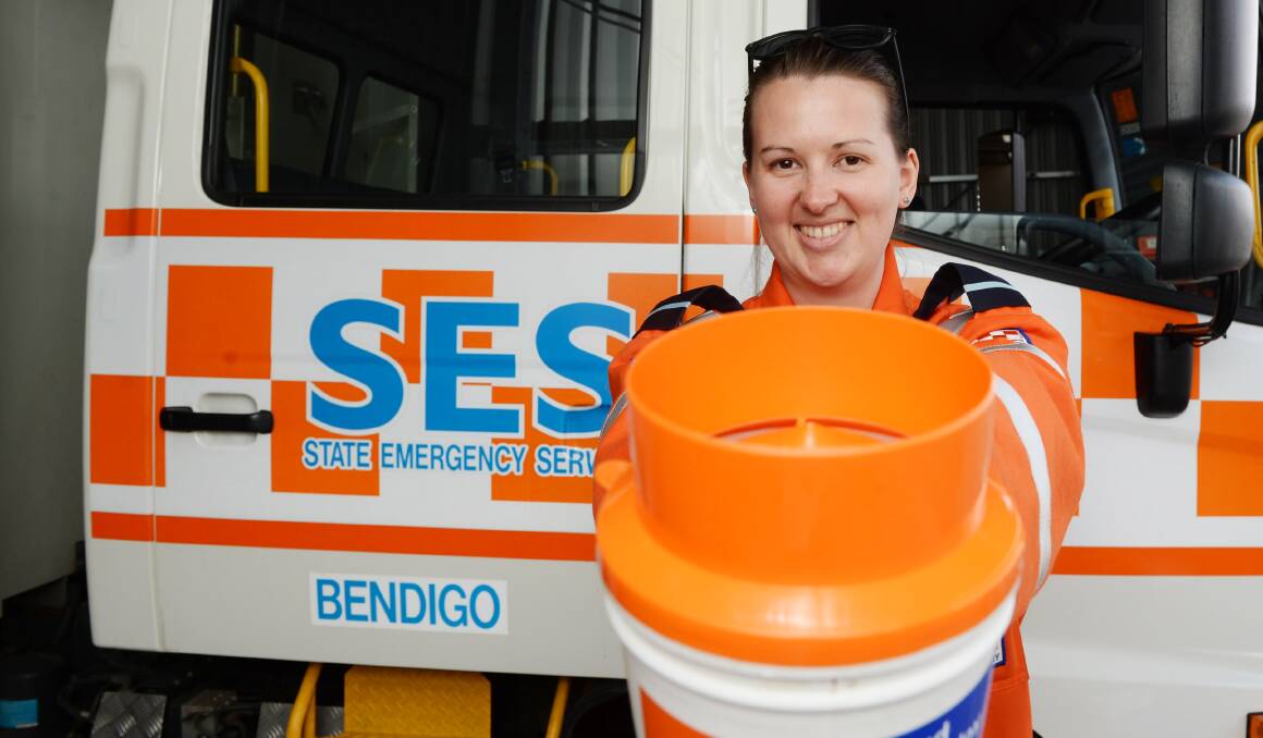 RATTLING THE TINS: Bendigo SES volunteer Bec Maskell will be one of many crew members fundraising at Alexandra Fountain on Saturday. Picture: DARREN HOWE