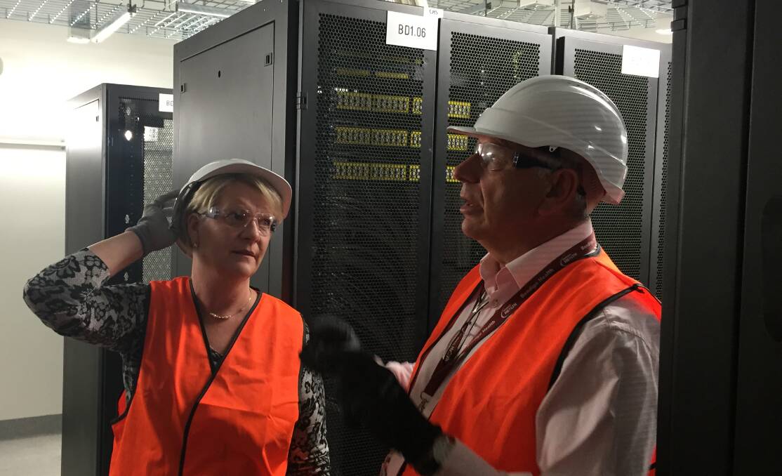 INFORMATION: Maree Edwards and Bruce Winzar talk technology in one of the server rooms at the new Bendigo Hospital. Picture: CHRIS PEDLER