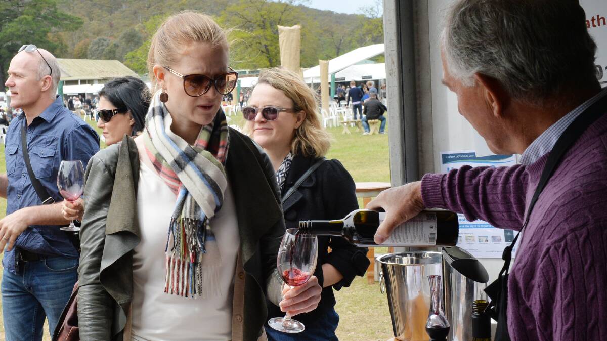 GOOD DROP: Davinia Lewis tastes one of the wines on show at the Heathcote Wine and Food Festival last year. The festival returns on October 7 and 8.