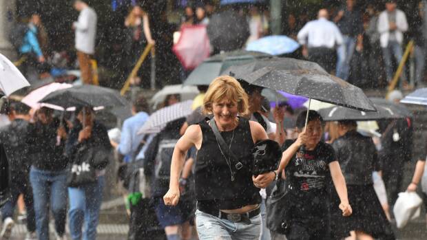 Heavy rain hits Melbourne. Photo: Joe Armao