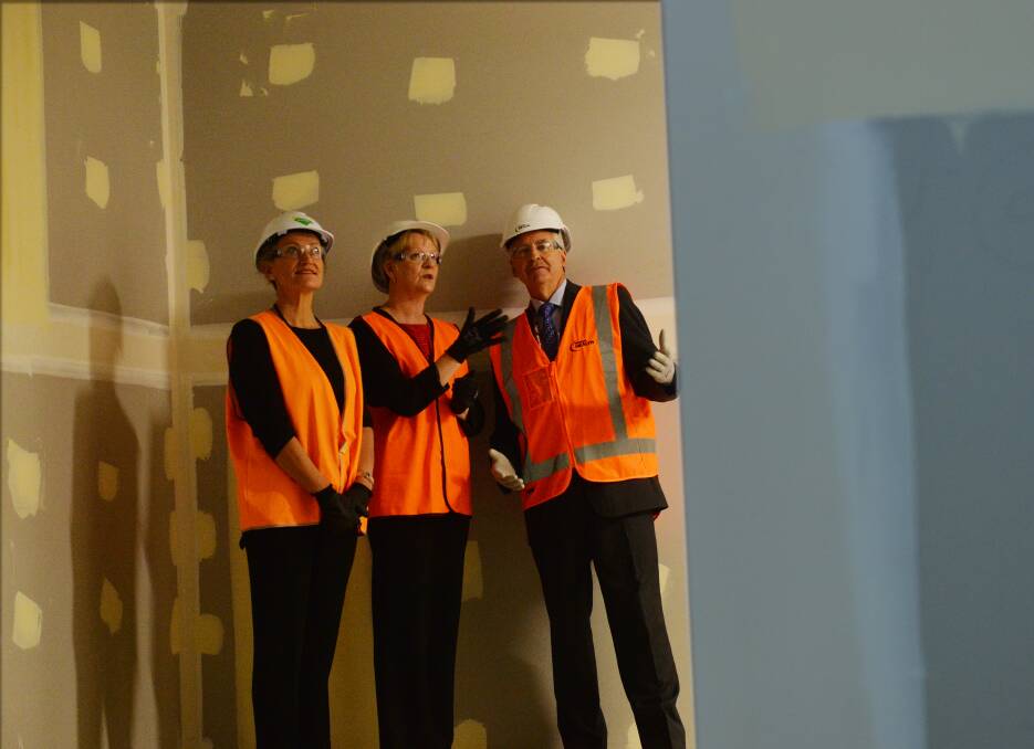 Peter Mac CEO Dale Fisher, Bendigo West MP Maree Edwards and Bendigo Health CEO John Mulder inspect the future centre. Picture: DARREN HOWE