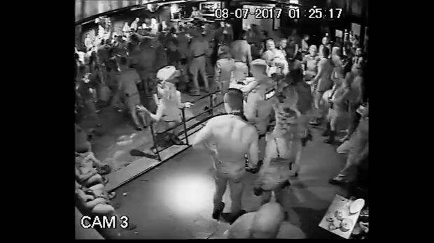 A policeman dancing with a woman at Inflation nightclub, shortly before a shooting that is under investigation.