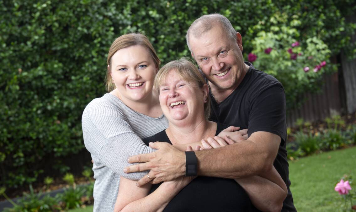 HELPING HAND: Tara, Sue and Paul Johns will open up their newly renovated home to the public to raise money for a research fund created in honour of their late sister and daughter Beccky. Picture: DARREN HOWE