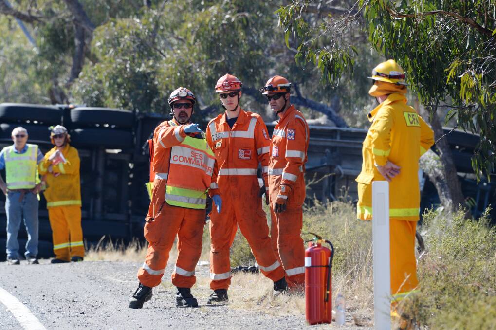 Emergency workers attend a fatal crash at Axedale. Picture: DARREN HOWE