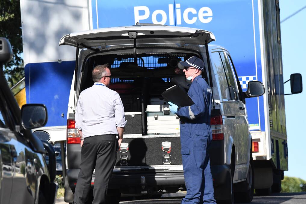 Police at the scene of a fatal stabbing in King Street. Picture: NONI HYETT