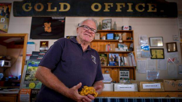 John Gladdis with a gold nugget replica at his shop in Maryborough. Picture: EDDIE JIM

