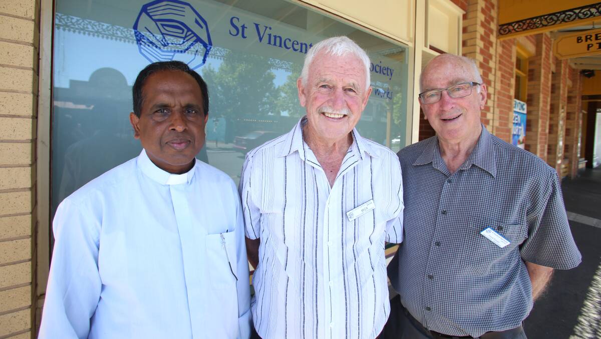 COMMUNITY: Father Antony Pedickattukunnel, St Vincent de Paul Eaglehawk conference president Mick Rodda and North Eastern Central councillor Frank Purcell outside the new centre. Picture: GLENN DANIELS