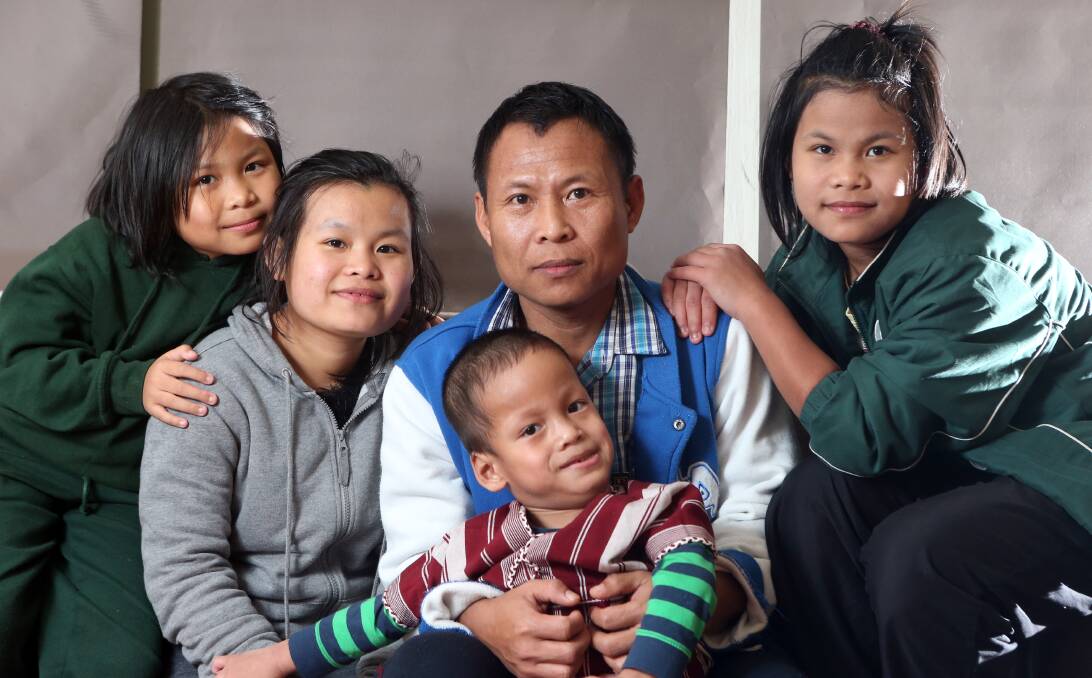 OPTIMISTIC: Shwe Myint and his children Pa Kler Moo, Du Du, Ma Pwa Pwa and Saw Say Wah arrived in Bendigo a year ago as refugees and are now thriving. Picture: GLENN DANIELS