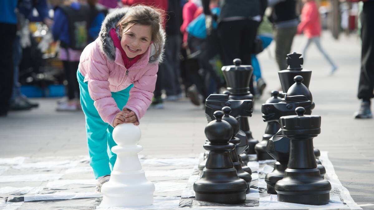 FUN: A young resident enjoying last year's school holiday fun day in Hargreaves Mall.