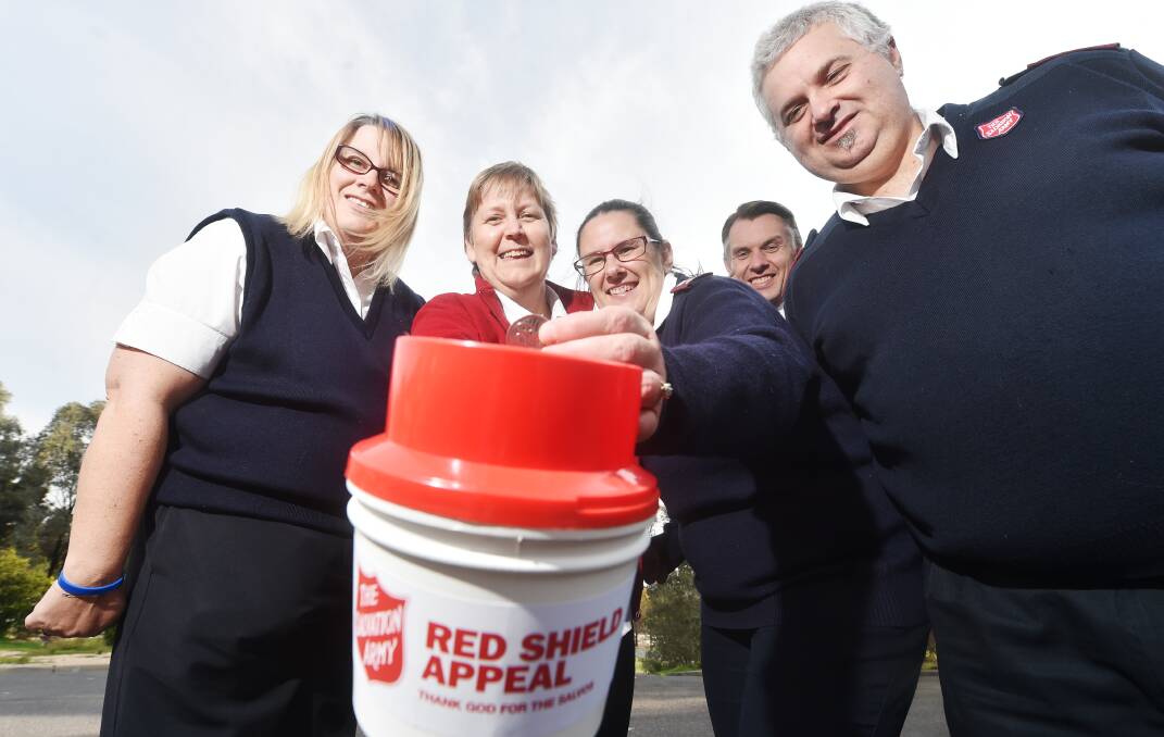 GIVING: Melissa Marsh, Kaye Viney, Kelly Walker, Andrew Walker and Chris Marsh are ready for the Salvos' Red Shield Appeal. Picture: DARREN HOWE