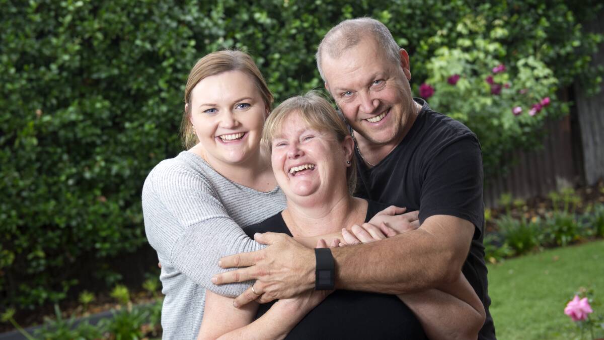 GOOD CAUSE: Tara, Sue and Paul Johns will open their home to raise money for the research trust established in honour of their late sister and daughter Beccky. Picture: DARREN HOWE